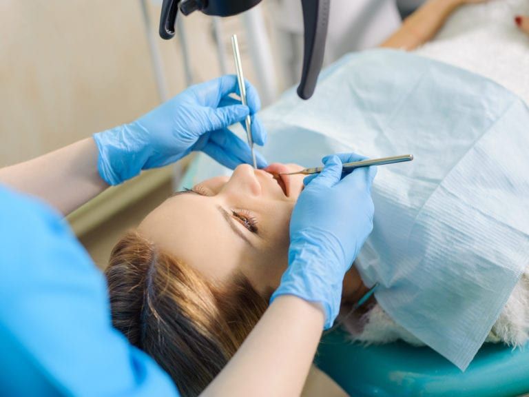 A woman undergoing dental care